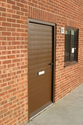 G15 steel door in Van Dyke Brown plastisol construction